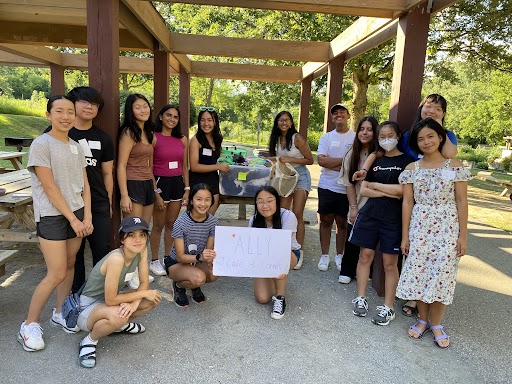 ALLY Michigan 2022 team holding up ALLY Sign